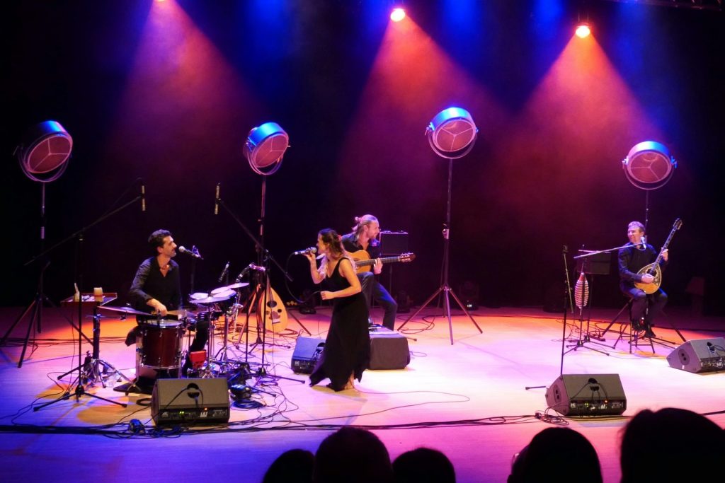 people singing on stage